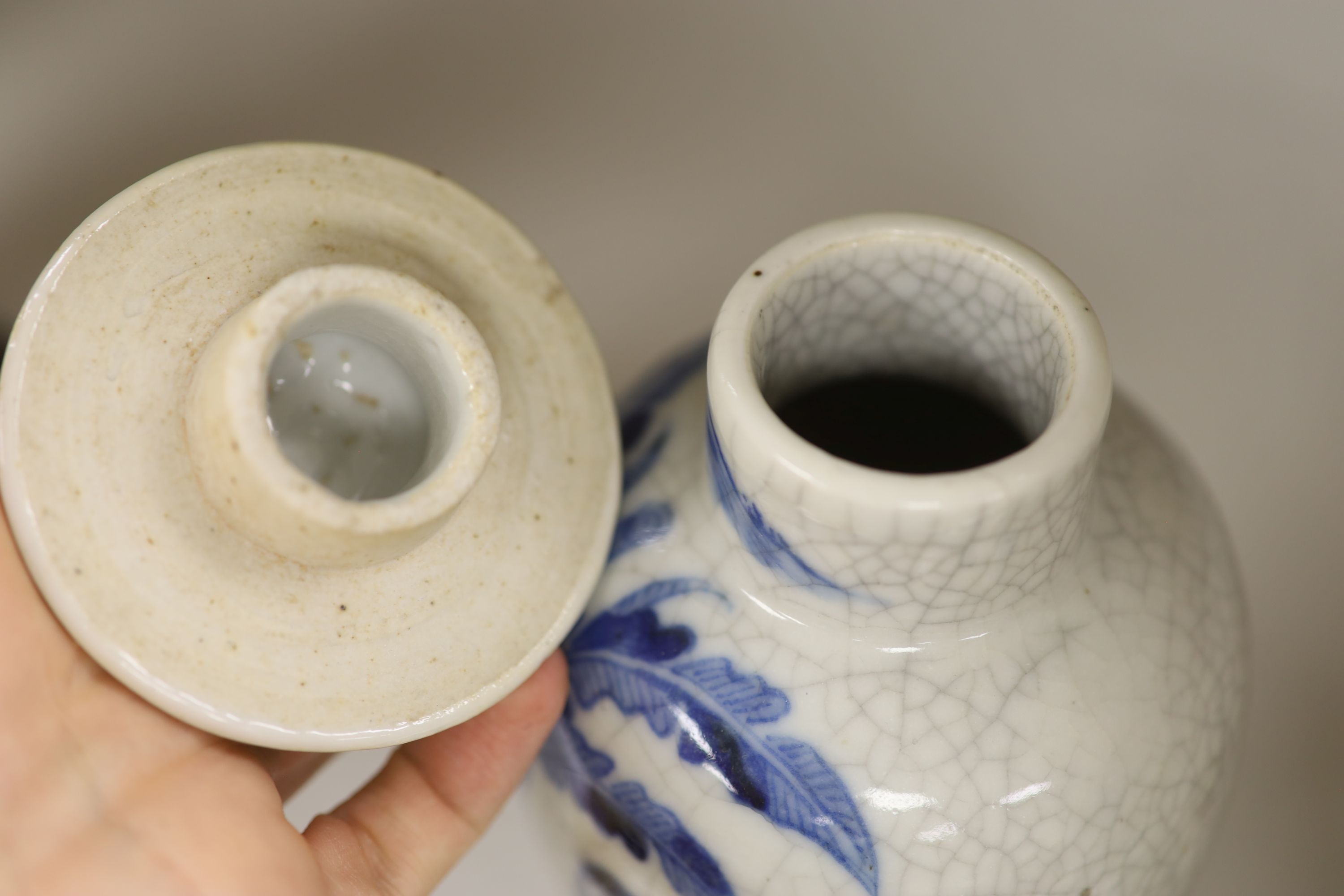A late 19th century Chinese blue and white crackle glaze vase and cover, height 27cm